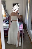 I ordered a S which is what Lulu's size guide told me to, and it fits perfectly! Its super comfy! I got this for my bachelorette party this upcoming August. The skirt is a bit thin and somewhat see-through, and I have a strapless bra on in the pictures because the top has no shape to it. Overall, I love it! - Catt M.
