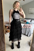 I ended up returning this, just because I couldn't find enough things to wear with it. The skirt itself runs a little large and sits lower on the hips, versus at the waist like normal. It's pretty long and falls about mid-calf. There's a lot of material with it, but it's fun to swish. It was cute, just ended up not being my style. Did enjoy styling it a little emo; it was fun. - Elizabeth S.
