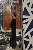 It shows off cleavage (or lack thereof) without revealing too much boob. And, it is a dress friendly to those of us who don't have much happening in the boob department. The dress doesn't give any illusion that makes my boobs look bigger, but it does successfully flatter what I have. The dress comfortably covers all of my boobs and doesn't have too much extra fabric in the area (again, small boob friendly). In general, the dress hugs whatever curves I might have. It definitely helps give your ass some shape. You should note though, that if you have curves that you don't like, it will highlight those as well. As a tall girl, the length is surprisingly pretty good! When I'm not in heels, it's floor length. That does mean that when I do wear heels it can/does look kinda odd with the length of the dress being above the floor, but like I can get over that for all the other positives that this has. - Jaz L.