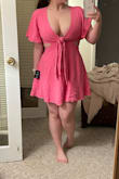 This dress is super cute and flattering, but larger-chested girls should be aware of just how much cleavage will be on display. I'm a 32H, and personally don't feel comfortable wearing this dress without something underneath to provide more coverage. And no, you can't tie the top in a way to provide better coverage. - Amanda G.