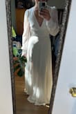 I usually have issues with long-sleeved clothing fitting my broader shoulders and wide wrists, but not with this dress. This dress fits like a glove while still being flowy and super comfortable. The waistline hits in the perfect spot to accentuate your curves. My body type is fairly triangular so I'm super stoked to have a waist shine through. The neckline is gorgeous. The back is gorgeous. Like everyone else mentions, it's a little long. I don't plan to have mine altered because the length is manageable and with this being my 2nd look dress I don't mind if the skirt gets a little dingy. It is a tad see-through so definitely planning to wear a sticky bra and nude underclothing, but what's new? Overall: recommend it! - Lindsey D.