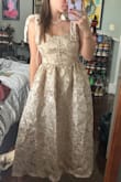 I think this dress is beautiful! I was hoping it would be more of a cream/off-white color because it looked that way in the photo but it's definitely more on the gold side. I'm still going to wear it to my Bridal Shower. It's great quality and very feminine cute. - Mariah K.