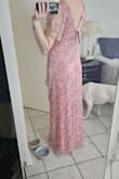 Dress is exactly as pictured. Very pretty. Ended up returning because it wasn't quite as formal as I needed. - Kristine J.