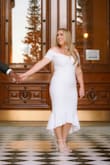 Love, love, love this dress! I tried on tons of styles and decided on this for our engagement photoshoot. I have it sitting in my closet in hopes I'll wear it again for an event. The fabric has some stretch which makes for a comfortable fit. - Danika T.