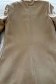 While the coat resembles the picture, I'm disappointed by its wrinkles and a small patch of missing material on the back. Unfortunately, being on sale precludes exchanging it. I feel hesitant to wear it due to this, although I would have otherwise recommended it without hesitation. - Sophia M.