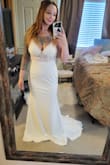 This dress is of amazing quality with enough durable fabric but light enough for a beach wedding. It has beautiful lace vines and hugs the curves perfectly with a cute train behind! I love the bra pads, so no need for inserts or help with a lift! - Steph B.