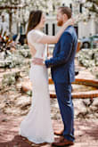 I loved this dress for my private ceremony. It was super stretchy and comfy. I will warn that the material is soft and will collect anything on the ground that touches it. There was a lot of material on the flounce sleeves which I had completely fitted to my arms, which I LOVED on me. The bust is very low. I had it taken up about 1.5 inches, not because of modesty, but because it I liked it better. - Maggie T.