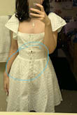 I'm super disappointed I have to return this dress. As much as I love it, the buttons do not keep the dress together. They're also poorly attached. One actually fell off when trying to button it. Speaking of buttoning, the buttons do not keep the dress closed because you have to loop them through elastic instead of inserting them into a hole. Like, imagine a tiny hair tie. That is what's holding the dress together. - Roberta K.