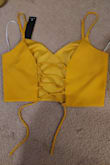 The top is a little difficult to put on because it runs small and I am afraid of pulling out the cords that are holding it together. The pants are super long, but the waist feels tight/small like the top. The yellow color is very vibrant and what I was looking for. This jumpsuit is versatile because you can style it more formal or more casual, wear it with or without a jacket/layer, and wear the top and pants separately. The fabric and straps do feel a little thin and fragile. - Katelyn B.