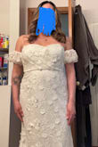When I opened this box and pulled out this dress, it was beautiful. I didn't think I was gonna get this kind of quality from a dress that was so low-priced. The fabric is beautiful and does not feel cheap at all. When I put this dress on it fit like a glove. I just had a baby so I do have weight that I was afraid that it was going to show through. It did not. I am so happy and recommend this dress. And the train on this dress is just long enough to not be over the top. I am definitely in love and cannot wait to wear this for my wedding! - Nicole V.