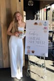 I bought this jumpsuit for my bridal shower and I loved it! I was nervous about it falling down since it's strapless and how see through the material would be with it being white. I wore nude undies and they didn't show through at all, and the top stayed up well! It was super comfy and the fabric feels pretty durable as well :) - Brooke M.
