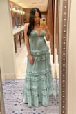 This was such a pretty dress! I recieved many compliments! I love the ruffles, flowiness of it, and the sage color of it! It was too long so I had about 3.5 inches cut off (I wore 3 inche heels and length was now perfect) It was difficult to zip up, but it will zip! I'm 3 months postpartum and this dress hid my baby fat that well. It was just a tiny bit snug in the under bust area, but that's because of left over pregnancy weight and I gain weight in my back (stubborn back fat) but the dress still fit. I would even say it snached me in a little in the under bust (I think a medium would have been loose) Oh, and I breastfeed and that was a breeze to do on this dress!! I ABSOLUTELY LOVED THIS DRESS! I wouldn't mind repeating this outfit again! - Jeanette P.
