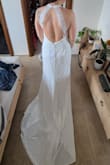 The dress is stunning! I took size M even though I knew it will be a little bit large for me so I can adjust it. The dress is beautiful, high quality fabric and the delivery was super fast. Highly recommend it. - Juliana J.