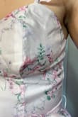 The quality is beyond horrible. The material is cheap and the cups are the biggest issue. They are weirdly shaped, uneven, and see-through. The dress material itself feels like a child's dress-up dress. It is also longer than it appears in the photos and almost touches the ground and I am by no means short. Do not purchase this. This is worse than SHEIN quality for a much higher price. I'm not sure a skilled seamstress could salvage this. - HANNA F.