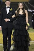 I wore this dress for homecoming court and loved it! Was a little scared to not get a sparkly dress like everyone else on the field, but the tulle made me stand out. The dress was not uncomfortable and made me feel so pretty. I got compliments all night and had friends all the way in the higher stadium seats say that I stood out. The tulle is wrinkled when you get it so I had to steam it, but besides that, it was great! - My-Lan E.