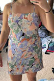 This dress was very pretty and I loved the colors. I ended up returning it because I didn't like how it looked on me. I have wider shoulders and I just felt like a box. Would have liked it more if it was fitted - Caitlyn R.