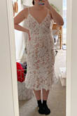This dress was really beautiful, super well made and elegant. I am usually a M but all there was left was L, I ordered it anyway because I liked the dress so much but it was unfortunately too big on the chest. It did fit nicely on my hips though. - Jacki B.