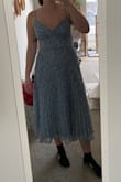 This dress was really pretty and could definitely be dressed up or down. The zipper got stuck whenever I tried to zip it up so I had to be really gentle. Overall it was a great dress and I liked the gold flecks, I had just ordered a size up because my size was out of stock (M) and it was too big. - Jacki B.
