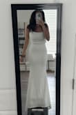 This dress was great. I ordered so many for my wedding & ultimately went with another dress. It's more ivory than white, and I will say that there is a lip of fabric at the waist line that just kinda sits there. It gives a look as if the top of the dress was tucked into the bottom and there is a fabric fold. Otherwise, the dress was great & fit like a glove. I could've gotten away with just [that] - Alyssa R.
