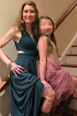 I really love this dress! It fits perfectly. I purchased XS and appreciated being able to wear a regular bra with the way dress was made. The material is high quality and several layers. I never get dressed up and this dress made me feel beautiful. - Allison F.