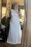 This was one of many dresses I ordered from Lulus to try on for my intimate wedding coming up in May! I didn't end up purchasing this dress but it was a close second! I am an XL in the dresses and I loved that I was able to size up with this dress so that I had more of a flowy look and I could have alterations to make it fit perfectly. The material was thick and comfortable. I loved the high neck and the open back, I ultimately wanted something with some more details on the back but I really loved this dress as well. The dress I ordered was a 2XL, in the photo I am pulling it back to reveal my shape and give an idea of how it could be altered and fitted. - Makenzie B.
