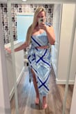 This dress is perfect for the beach or vacation! The blue pattern is really pretty and will look so good with a tan. The shoulder ties at the top to make it adjustable and his large chest friendly. It has an attached piece of material that ties on the side which is a super cute detail (but it's connected to the skirt already so doesn't make it adjustable) would definitely recommend purchasing it! - Marti C.