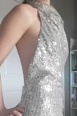 I was choosing between a few options for a Vegas wedding and as soon as I put this on I knew "This is it"-- it is shiny and elegant,  no bra needed! The material is good quality too! I tried it on twice and haven't found any sequins on the ground :) - Haley J.