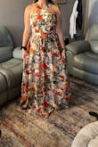 It is exactly what I hoped it would be! Depending on your breast size and comfort level, a bra is not necessary! It is long so you may need to carry the end or wear really high heels but I love a dress that is longer than shorter! - Madison T.