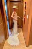 The small fits like a glove, but there is no stretch; be warned. I love the look with a hat and will braid my hair with extensions for my big day. Thanks for the gorgeous, affordable wedding dress. I plan to cut it off after and use it again. - Lenore L.
