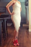 I wore this dress out for our wedding anniversary dinner. It runs true to size but was a tad bit snug. The material does stretch so I wouldn't have sized up. Very pleased! - Darcy H.