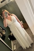 This dress was very pretty! I ended up sending it back but it was my second choice out of the dresses I ordered to try. It's very pretty and flowy, and the lace is beautiful on the top portion. Combined with a pretty bridal belt, it would be perfect. I ended up returning it because I am apple-shaped and carry most of my weight in my stomach, and the way it laid you could see my belly and bellybutton lines and I didn't like that personally. - Katherine S.