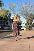 I sized down due to a recommendation and it fit perfect! The sleeves are a little snug, but still so comfortable! I loved this dress and can't wait to wear again. - Erika B.