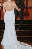 I purchased this dress for my elopement, it hit every expectation I had for my wedding dress. I was looking for something timeless, cost-friendly, fitted, and would match a small chapel's aesthetic. My dress arrived within a few days of ordering it, I am not sure if this is because of where I'm located or if they always ship that fast but it was perfect! I used the size estimator they have available and I am so glad I did because it helped me pick the perfect size. The only downside is I am 5'0 so of course this was long on me, literally every dress is, so personally this was not an issue. I wore 4.3-inch heels and was fine. My dress fit like a glove, I would highly recommend purchasing this dress! - Sabrina B.
