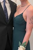 I chose this dress to wear to my brother's wedding! It stayed put and thanks to the lace-up gave enough support for me to go braless. The slit isn't too high and the dress was the right height for me with a 3" (I think) heel. I love the lace-up detail from the back but (as I could have predicted) there weren't any photos of the back, which is kind of a bummer! The front is simple and cute but if I could do it over I'd choose based on the front of the dress a bit more. - Kelly M.