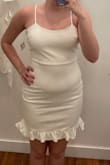This dress is super cute but if you have even the smallest amount of belly fat, this dress will hug it! I just don't feel comfortable in the dress since it accentuates my stomach area. - Kelly C.