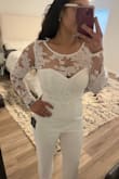 I am pretty happy with this jumpsuit! It's very classy. Fits a little snug in the shoulder/bust area for me personally, but I know a size L would be too big for all my other areas! Can't win 'em all, I guess. - Tina T.