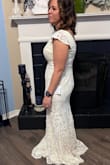 I can't get over how perfect this dress fits me. It was very flattering and hugged my body in all the right places. It is a bit long so I am considering having it altered. But the fit was dead on. I am usually a large in most dresses; I ordered the large, and it was definitely the right size. Can't wait to wear this at my wedding! - Nicole O.