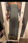 This dress fits true to size and is sooo pretty! My favorite part about this dress is that there are grips on the breast part that will not let the dress fall down. Least favorite part was that it was very long. Even with taller heels, I had to get it hemmed. - Hannah H.