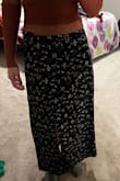 In the pictures, it is a high waisted skirt. It is not actually high waisted; it is a normal rise. Because of this, it's way longer than the picture. I got an xs so I literally could not size lower to try and make the waist a tighter fit. - Arlie M.