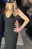 This dress was comfortable and very sexy. I liked that I could comfortably wear a bra. It's pretty low cut, for lots of cleavage. I'm 5'4" and wore high heels. I couldn't have worn flats. Nice quality fabric, but wrinkles took a lot of steaming to get out. - Kelly K.