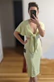 This dress is very cute but I think sizing is a little off. I went with my normal XS and it juuust fit on the bottom but the top was really loose. If I went a size up the bottom would be more comfortable but then you're left with so much fabric up top. You're only solution is to tie the front really tightly and you end up with a huge knot that is not flattering. But I did end up keeping because I like the material and that it has sleeves to protect my shoulders from getting sunburned! - Beatriz K.