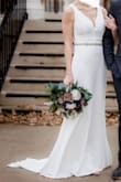 This was the perfect dress. I was nervous when I first ordered it since I knew I would be gaining a little weight, from the time I ordered to the time it arrived. It fits like a glove. I naturally have wider hip bones than most people, and it still was not snug. It was more like a wedding dress than I could imagine. The dress is not sheer and has a beautiful train. I maybe could have had it hemmed an inch or two, but I loved the length it came in. I am wearing 1 inch heels. I could be in this dress all day with how comfortable I was. - Sierra H.