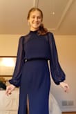 I got this dress for my senior prom, and it was so beautiful! The dress fit perfectly; the sleeves were long enough; the neck wasn't too tight, and the length was long enough to wear with my 3 in heels. The open back was so classy, and I received many compliments on the uniqueness of my dress. I can't wait to wear it again! - Bethany G.