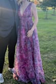 This dress is stunning. I got a lot of compliments on it. Fit well, was very comfortable. The only thing I would suggest is to buy double sided tape to tape it down to your chest. When you slouch, the fabric pops open a little bit. Overall it was a great find and the fabric makes it look more upscale. - Janine C.