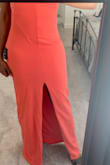 I was really hoping this dress was going to be the one. Unfortunately, it is not. The color is a beautiful coral/pink. It fits true to size, but I had to adjust the straps. I had to return because there is a line/hem that runs down the front of the dress, and it's unflattering and just looks weird. The split was also in a good place, so I really hate that the lines mess this dress up for me. - Naya J.