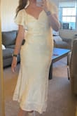 This dress is beautiful!! I love the material and the sleeves. Fits good, my only note is that it fits really weird on the chest. It doesn't sit flat and therefore doesn't feel as secure or comfortable in the chest area. Still very pretty and perfect for graduation!! - Audrey C.
