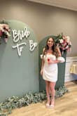 I bought this with a bunch of other white outfits from Lulus and ended up loving this dress the most. It was absolutely perfect for my bridal shower. I felt super comfortable and beautiful in it. Highly recommend! - Victoria H.