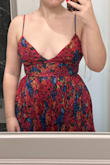 I wish I could keep this dress. It's a great length (hitting halfway between my calf and ankle), and most of it is actually super cute, but the size of the cups of this dress is making me return. I'm a 36D, but kinda a wide-set D, so fortunately I wasn't spilling out of the dress, but it came down to basically where my bra band is. This dress reveals A LOT of chest. 

As for fabric, not amazing, not terrible. It's a mesh, stiff polyester. For some reason, I was expecting more of a cottony feel, but this feels more like a Halloween costume. But it's still so cute! - Sarah S.