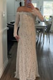 I realllllllly wanted to like this as my wedding dress. I would be curious to know what the size smaller would've fit like, but I also think that it would've been too restricting with the style of dress (low neck line with sleeves attached to the dress). If I kept it, I would look at making it a strapless dress by cutting the sleeves off, but still wearing the sleeves.
It also gave me nightgown vibes. - Mckenna L.