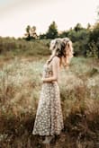 I wore this dress for my pregnancy announcement photos and it was perfect! The colors and print are subtle, and it flows so nicely. The back was a little tricky to tie at first but it's so worth it! - Chelsie C.